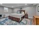 Finished basement bedroom with a queen bed and decorative rug at 5850 E 54Th Pl, Indianapolis, IN 46226