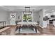 Bright dining room featuring a stylish chandelier, modern decor, and a view of the well-maintained backyard at 5850 E 54Th Pl, Indianapolis, IN 46226