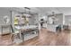 Bright dining area featuring a stylish chandelier, modern decor, and an open view to the living space at 5850 E 54Th Pl, Indianapolis, IN 46226