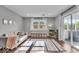 Cozy living area with a comfortable sofa, bright natural light, and sliding door to the patio at 5850 E 54Th Pl, Indianapolis, IN 46226