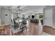 Open concept living room and dining area with hardwood floors and modern décor at 5850 E 54Th Pl, Indianapolis, IN 46226