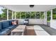 Relaxing screened porch with comfortable seating, perfect for enjoying the outdoors in comfort at 5850 E 54Th Pl, Indianapolis, IN 46226