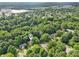 Serene neighborhood with lush trees and well-spaced homes, offering a peaceful residential setting at 5935 Oakforge Ln, Indianapolis, IN 46254
