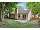 Charming backyard featuring a patio, fence, and plenty of trees at 5935 Oakforge Ln, Indianapolis, IN 46254