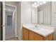 Cozy bathroom features a wood vanity with a white countertop at 5935 Oakforge Ln, Indianapolis, IN 46254