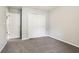 Neutral bedroom featuring a gray carpet, closet, and white walls at 5935 Oakforge Ln, Indianapolis, IN 46254