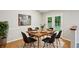 Cozy dining room with a wooden table, modern art, and access to the outdoor patio at 5935 Oakforge Ln, Indianapolis, IN 46254