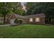 Charming brick home with a well-manicured lawn and mature trees in a serene, quiet neighborhood setting at 5935 Oakforge Ln, Indianapolis, IN 46254