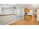 Well-lit kitchen with a breakfast bar and ample counter space with laminate flooring at 5935 Oakforge Ln, Indianapolis, IN 46254