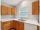 Efficient kitchen layout with wood cabinets, and ample countertop space at 5935 Oakforge Ln, Indianapolis, IN 46254