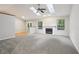 Spacious living room featuring a cozy fireplace, neutral decor, and an abundance of natural light at 5935 Oakforge Ln, Indianapolis, IN 46254