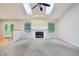 Bright and airy living room featuring a fireplace, large windows, and hardwood flooring at 5935 Oakforge Ln, Indianapolis, IN 46254