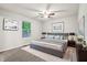 Comfortable main bedroom featuring soft carpet, a ceiling fan, and artwork at 5935 Oakforge Ln, Indianapolis, IN 46254