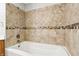 Modern shower with neutral tile and a built in shelf for storage at 5935 Oakforge Ln, Indianapolis, IN 46254