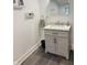 Charming bathroom with gray vanity, a modern sink, neutral decor, and slate flooring at 597 W Adams St, Franklin, IN 46131