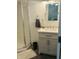 Bathroom featuring a vanity with a countertop sink and a glass-enclosed shower, combining style and functionality at 597 W Adams St, Franklin, IN 46131