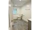 Bright bathroom featuring a modern toilet, slate flooring, and a functional layout at 597 W Adams St, Franklin, IN 46131