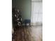 Cozy bedroom featuring sleek shelving and a bright window, offering a comfortable and functional living space at 597 W Adams St, Franklin, IN 46131