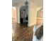 Hallway featuring an alcove with workspace, seamlessly connecting different living areas for added convenience at 597 W Adams St, Franklin, IN 46131