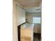 Bright laundry room with white cabinets, a window, and a modern washer and dryer for added convenience at 597 W Adams St, Franklin, IN 46131