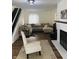 Cozy living room featuring a fireplace and comfortable seating arrangements at 597 W Adams St, Franklin, IN 46131
