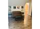 Stylish living room featuring a tufted sofa, record player, and curated wall art for a cozy and modern ambiance at 597 W Adams St, Franklin, IN 46131