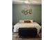 Serene main bedroom featuring stylish wall decor, a ceiling fan, and ample space for comfortable living at 597 W Adams St, Franklin, IN 46131