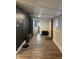 Cozy mud room with hardwood floors, laundry area, and a decorative chalkboard wall for added organization at 597 W Adams St, Franklin, IN 46131