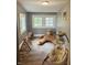 Cozy playroom featuring windows, hardwood floors, and ample space for play and relaxation at 597 W Adams St, Franklin, IN 46131