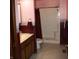 Bathroom featuring a shower, vanity, and patterned wallpaper trim at 6052 N Deckshire Ln, Shirley, IN 47384