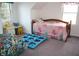 Cozy bedroom features carpeted floors, dual windows, and a bed at 6052 N Deckshire Ln, Shirley, IN 47384