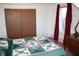 Cozy bedroom featuring plush carpeting, a sunlit window, and a built in closet at 6052 N Deckshire Ln, Shirley, IN 47384