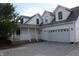 Exterior of home showing the garage, side porch, and clean white siding at 6052 N Deckshire Ln, Shirley, IN 47384