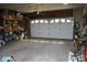 Interior of the garage showing concrete floor and shelving for ample storage at 6052 N Deckshire Ln, Shirley, IN 47384