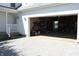 View of the garage entrance showcasing garage space and the side yard at 6052 N Deckshire Ln, Shirley, IN 47384