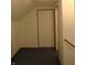 Neutral-toned hallway with carpeted floor and a closed white door with bronze trim at 6052 N Deckshire Ln, Shirley, IN 47384