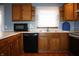 Traditional kitchen featuring wood cabinets, stainless steel sink, modern appliances and laminate countertops at 6052 N Deckshire Ln, Shirley, IN 47384