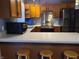 Kitchen with stainless steel appliances, wood cabinets and eat-in breakfast bar with seating at 6052 N Deckshire Ln, Shirley, IN 47384