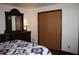 Bedroom featuring a queen size bed with floral bedding and matching dresser with mirror at 6052 N Deckshire Ln, Shirley, IN 47384