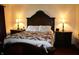 Comfortable bedroom features a queen size bed with ornate wooden headboard and bedside tables at 6052 N Deckshire Ln, Shirley, IN 47384