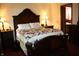 Warm, inviting bedroom featuring a large bed with ornate wooden headboard and matching dressers at 6052 N Deckshire Ln, Shirley, IN 47384
