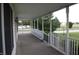 View of wrap-around porch looking out to the spacious, green front yard at 6052 N Deckshire Ln, Shirley, IN 47384