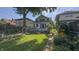 Home's backyard including a brick walkway and a wooden deck at 622 N Dequincy St, Indianapolis, IN 46201