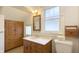 Bathroom with wooden cabinets and plenty of storage at 622 N Dequincy St, Indianapolis, IN 46201