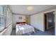 Bright bedroom with closet access and windows, offering a welcoming living space at 622 N Dequincy St, Indianapolis, IN 46201