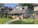Charming two-story home with brick accents, a well-manicured lawn, and inviting curb appeal at 622 N Dequincy St, Indianapolis, IN 46201