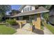 Charming two-story home with a welcoming front porch and well-maintained landscaping at 622 N Dequincy St, Indianapolis, IN 46201
