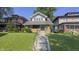 Attractive two-story home with landscaped front yard and inviting porch at 622 N Dequincy St, Indianapolis, IN 46201