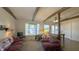 Cozy living room with exposed beams, large windows, and comfortable seating at 622 N Dequincy St, Indianapolis, IN 46201