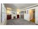 Bright living room with large windows, fireplace, and classic floral wallpaper at 622 N Dequincy St, Indianapolis, IN 46201